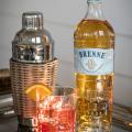 imagen de la botella brenne french whisky y el coctel brenne boulevardier